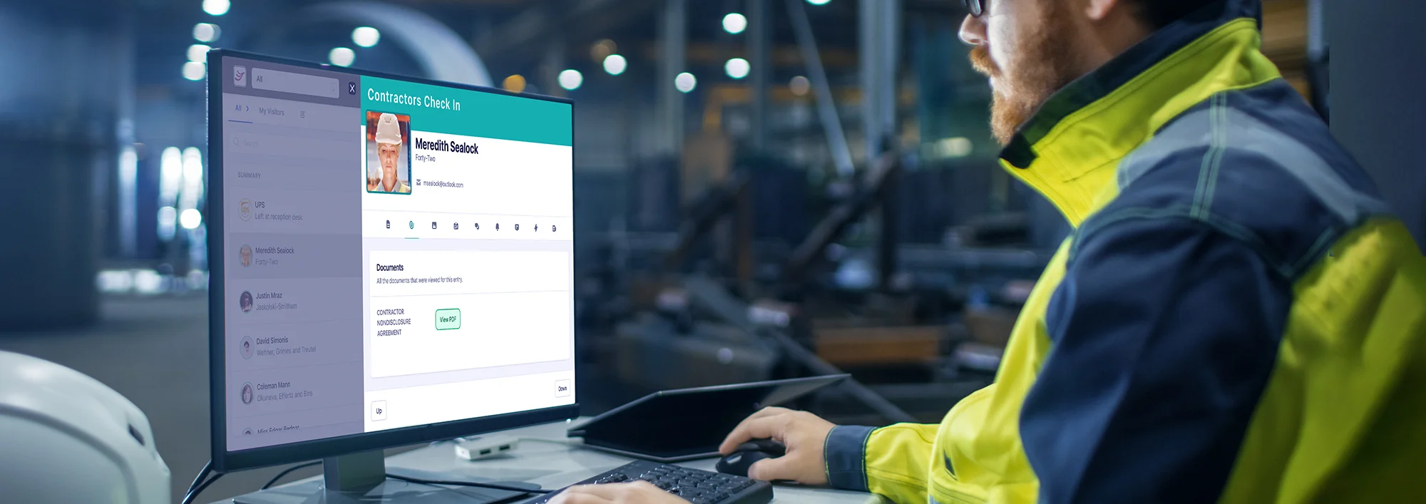 Security guard reviews employee check-in details on Receptful.